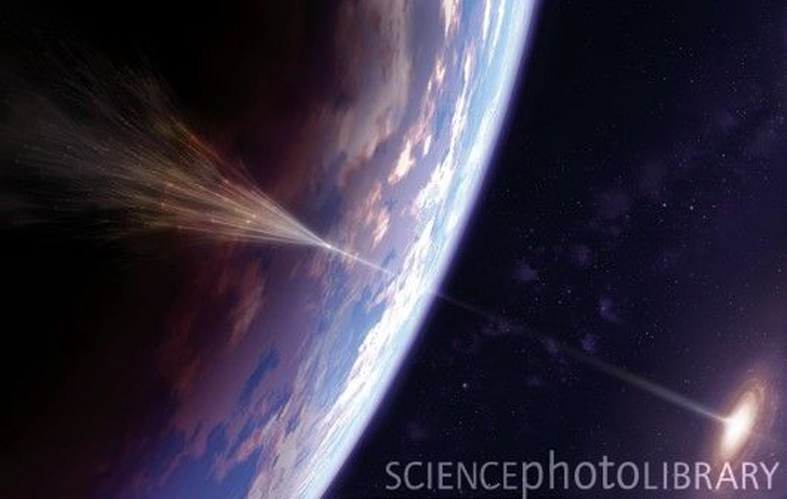 Artists conception of a cosmic ray, originating in a 'jet' from an active galaxy, colliding with the Earth's atmosphere and creating an extensive air shower.