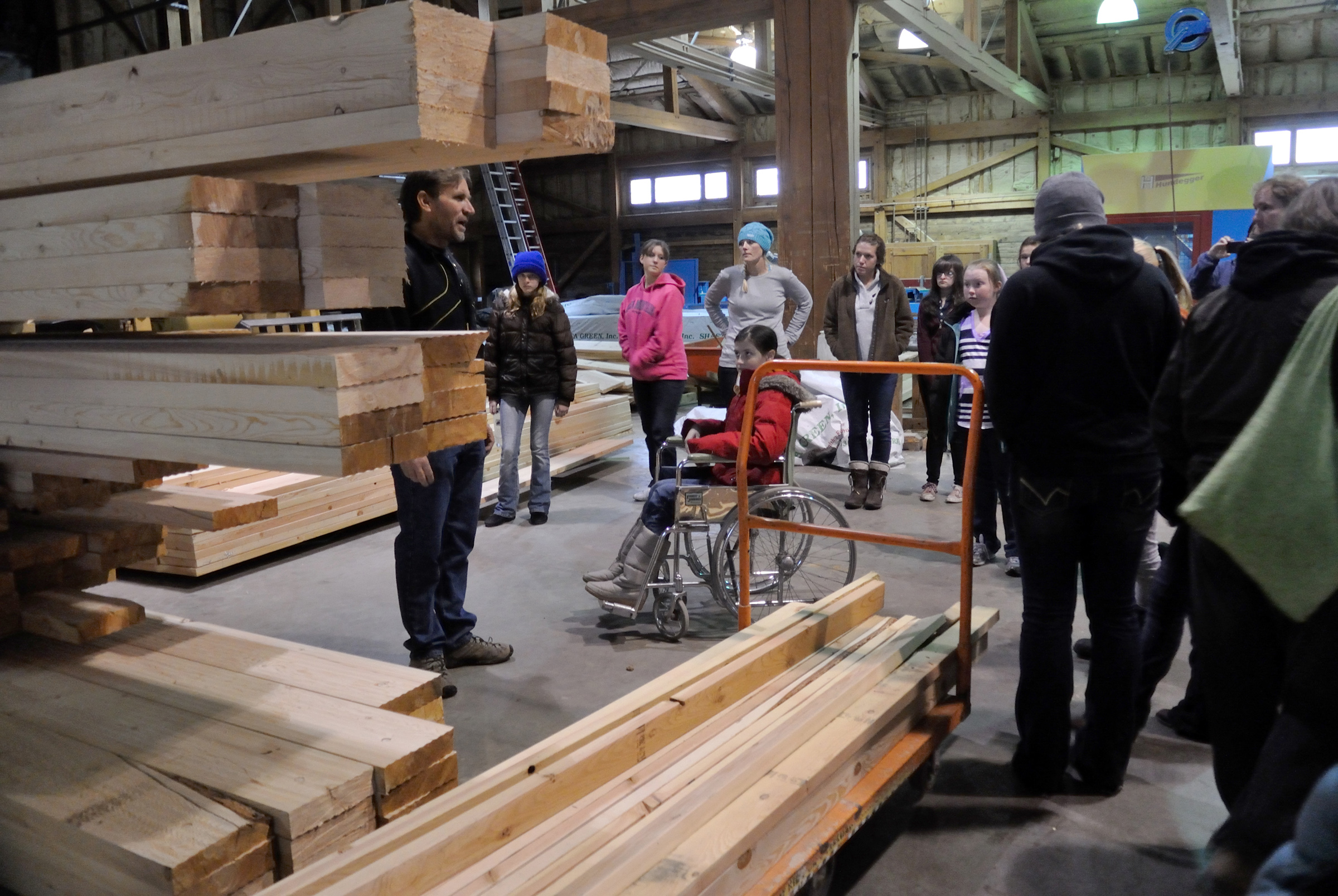 Girl Scouts tour Euclid Timber Frames, a partner on the project and which produces lumber from beetle-kill wood that will be used in the cabins at Trefoil Ranch.