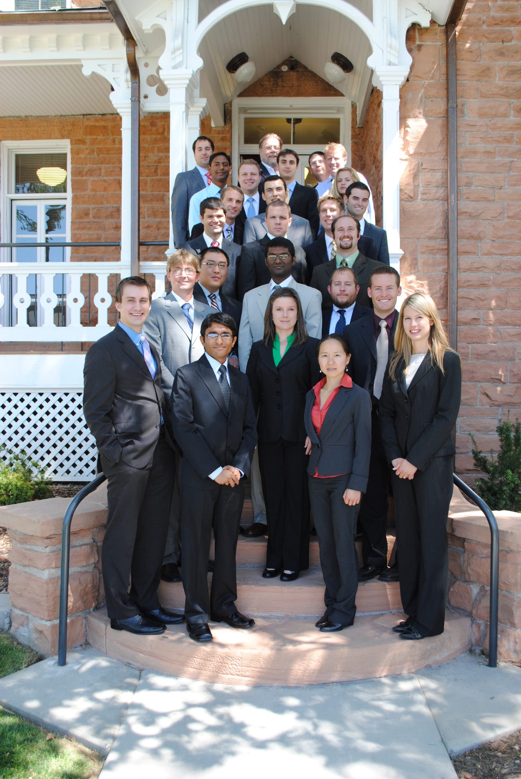 Graduate students in the Lassonde New Venture Development program stand in front of the Lassonde House at University of Utah. Students in the program help write business plans for faculty inventors.