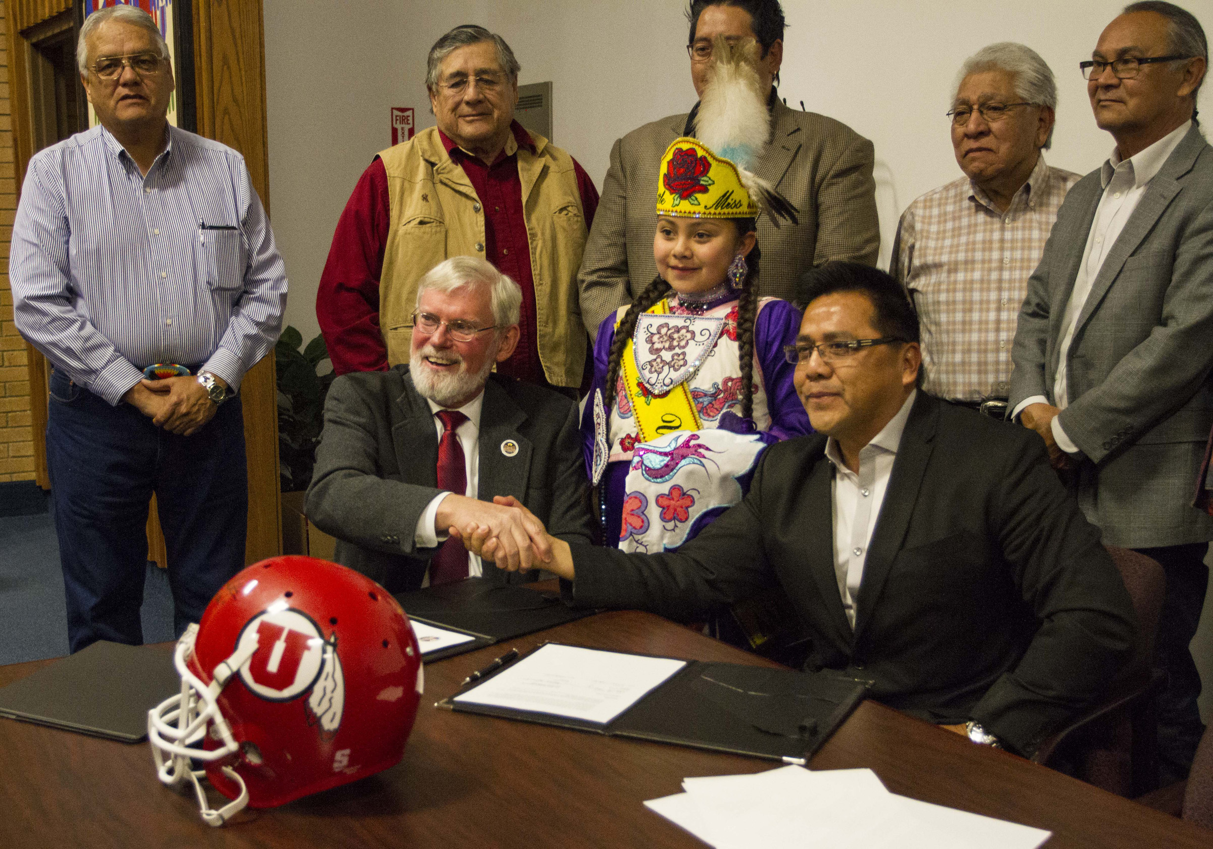 Left to Right President Pershing and Chairmen Gordon Howell, and members of the Ute Indian Tribe Business Committee shake hands after the signing of the Memoradium of Understanding at the Ute Indian Tribe Headquaters in Fort Duchesne, Utah.
