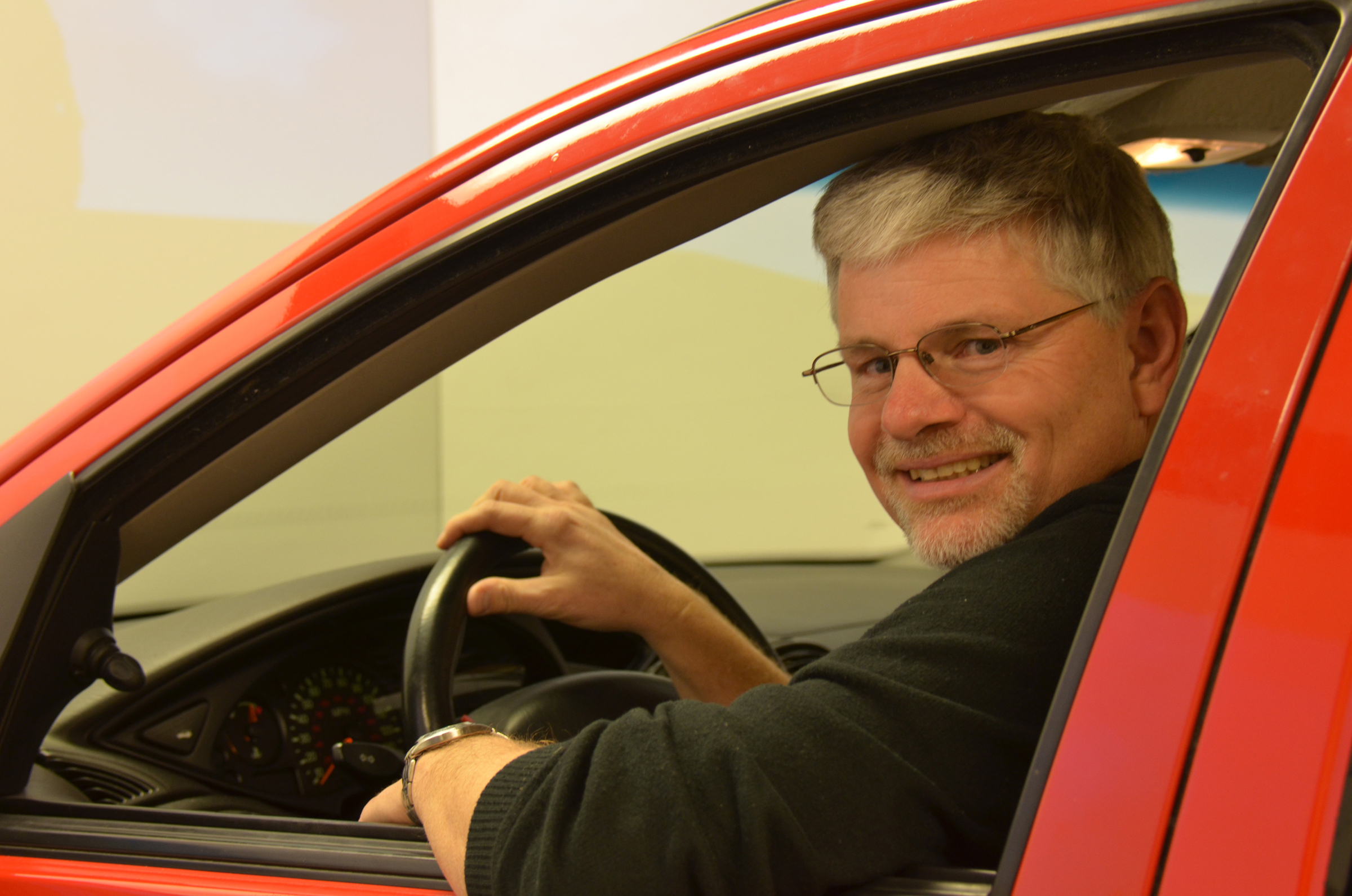 David Strayer, a University of Utah psychology professor, with a driving simulator that was part of a major new study he conducted for the AAA Foundation for Traffic Safety. The study found that, contrary to what many people believe, motorists are seriously distracted and put themselves and others at risk when they use hands-free devices to make cell phone calls, use social media or send texts or e-mails while driving.