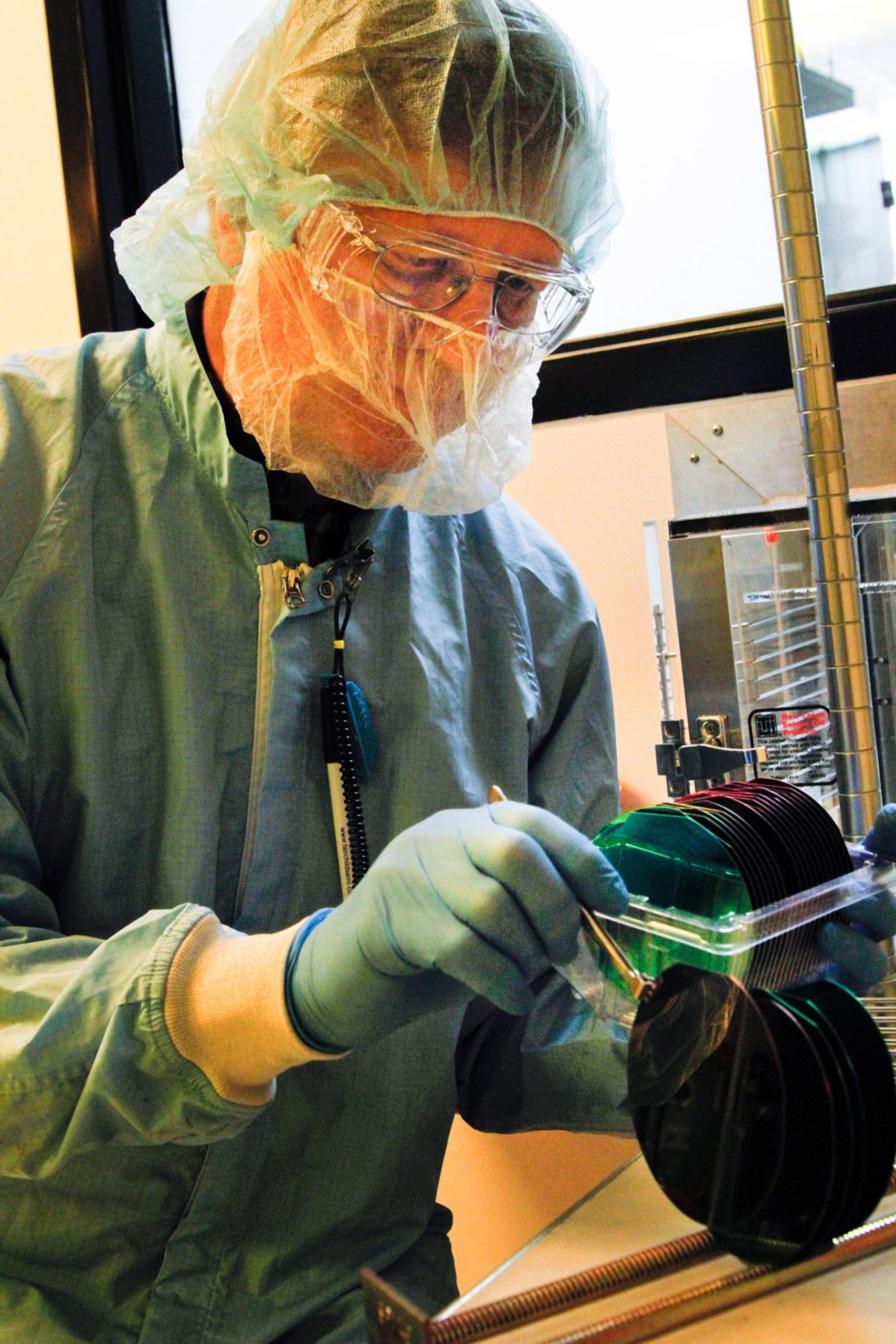 A researcher processes semiconductor wafers in the University of Utah's nanofabrication lab. Experienced engineers use advanced facilities and techniques like this at the university's new Center for Engineering Innovation, which transforms inventors' ideas into ready-to-manufacture devices.