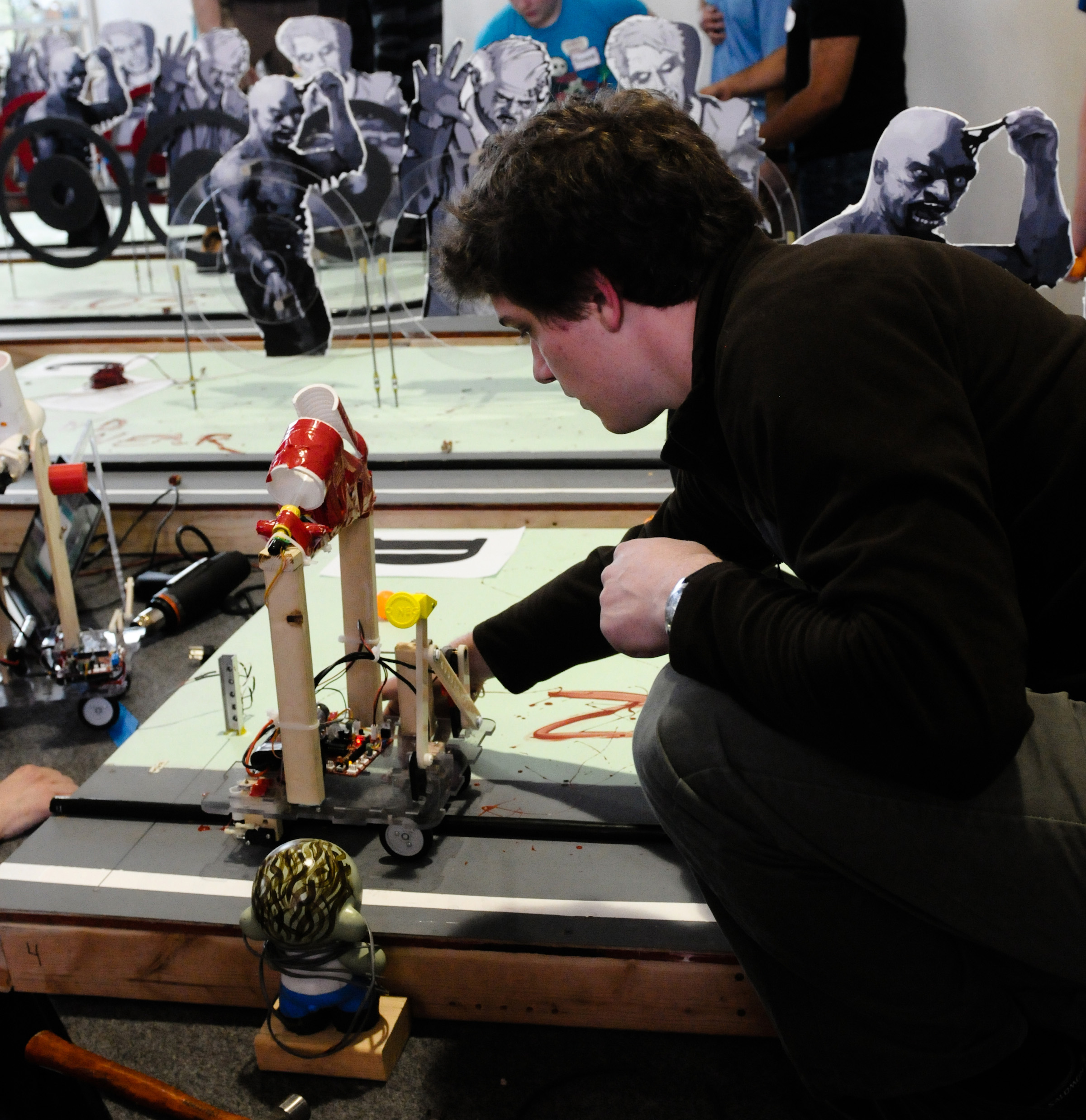 A mechanical engineering student prepares his robot for battling “zombies” during last year’s Mechanical Engineering Design Day at the University of Utah. This year’s event is scheduled for April 16.
